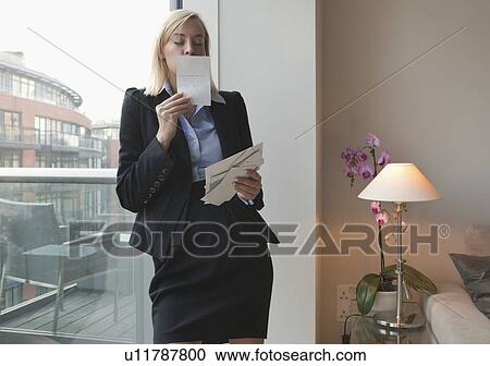 Woman kissing photograph View Large Photo Image Stock Image - Woman kissing photograph. Fotosearch