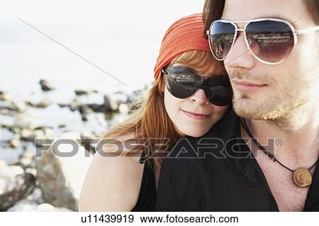 Woman leaning head on mans shoulder View Large Photo Image Stock Photo - Woman leaning head on mans shoulder. Fotosearch