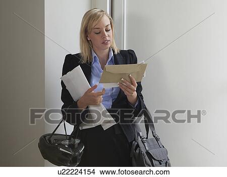 Woman looking at letters View Large Photo Image Picture - Woman looking at letters. Fotosearch