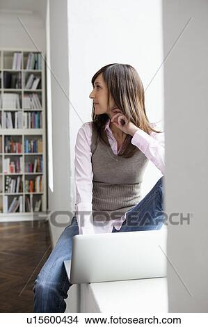 Woman looking back to someone View Large Photo Image Picture - Woman looking back to someone. Fotosearch
