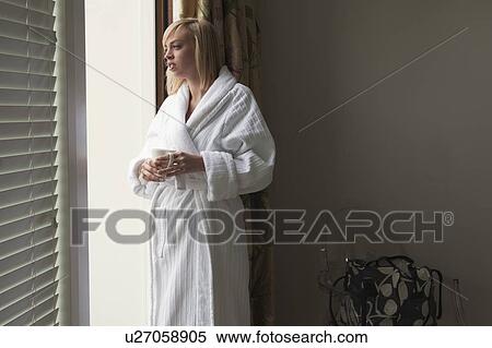Woman looking out of window View Large Photo Image Stock Photography - Woman looking out of window. Fotosearch