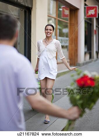 Picture - Woman meeting man. Fotosearch