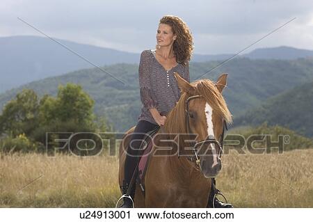 Woman on a horse View Large Photo Image Stock Image - Woman on a horse. Fotosearch