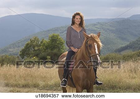 Stock Photo - Woman on a horse. Fotosearch
