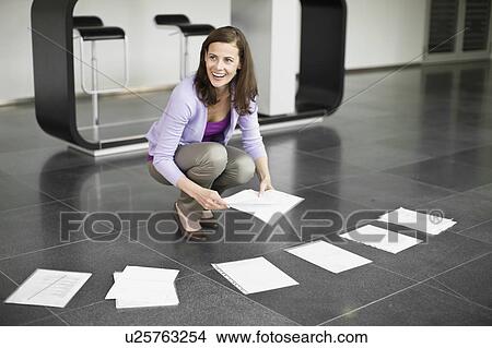 Woman preparing for presentation View Large Photo Image Picture - Woman preparing for presentation. Fotosearch
