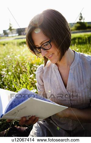 Picture - Woman reading book. Fotosearch