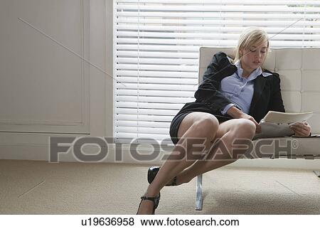 Woman reading papers View Large Photo Image Stock Photo - Woman reading papers. Fotosearch