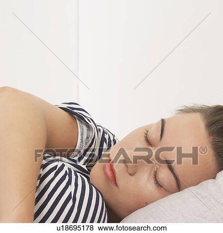 Woman reclined with eyes closed View Large Photo Image Stock Photo - Woman reclined with eyes closed. Fotosearch