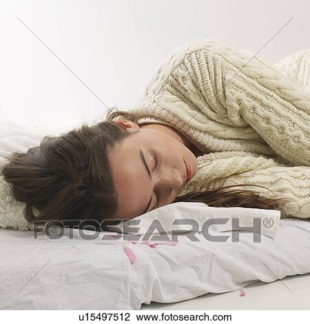 Stock Image - Woman reclined with petals. Fotosearch