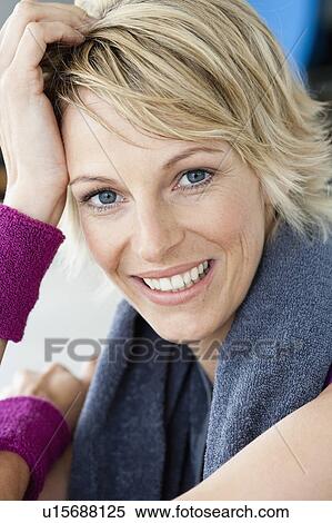 Stock Photography - Woman relaxing after sports portrait. Fotosearch