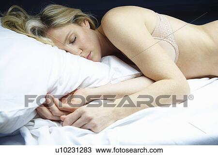 Woman sleeping in bed View Large Photo Image Stock Image - Woman sleeping in bed. Fotosearch