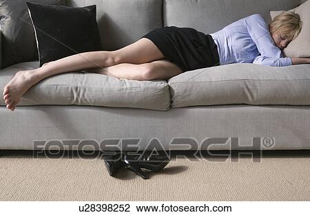 Woman sleeping on sofa View Large Photo Image Stock Image - Woman sleeping on sofa. Fotosearch