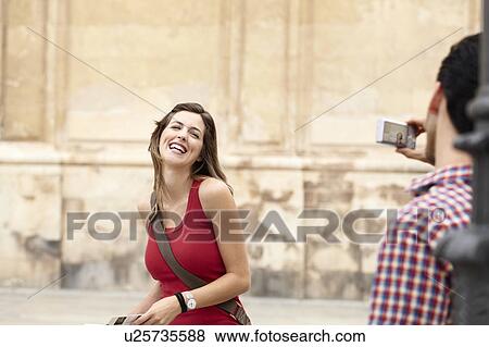 Woman smiling for holiday picture View Large Photo Image Stock Photo - Woman smiling for holiday picture. Fotosearch