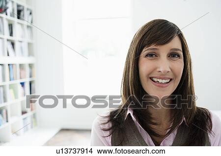 Woman smiling to camera View Large Photo Image Picture - Woman smiling to camera. Fotosearch