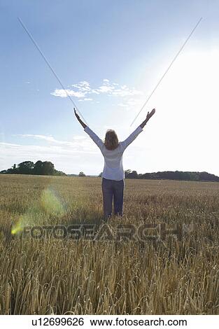 Stock Photograph - Woman sun worshiping. Fotosearch