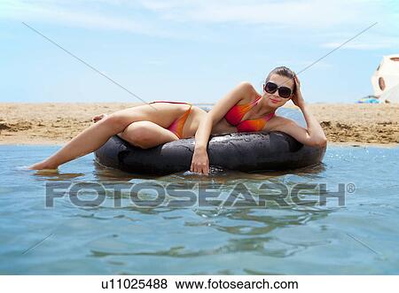 Woman swimming at the beach View Large Photo Image Stock Photo - Woman swimming at the beach. Fotosearch