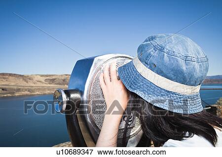 Woman using telescopic viewer View Large Photo Image Stock Photo - Woman using telescopic viewer. Fotosearch
