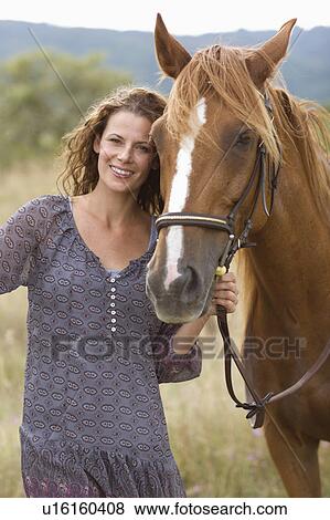 Stock Photo - Woman with a horse. Fotosearch