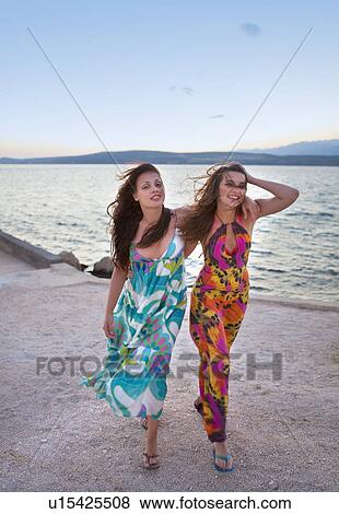 Women at the beach View Large Photo Image Stock Photo - Women at the beach. Fotosearch