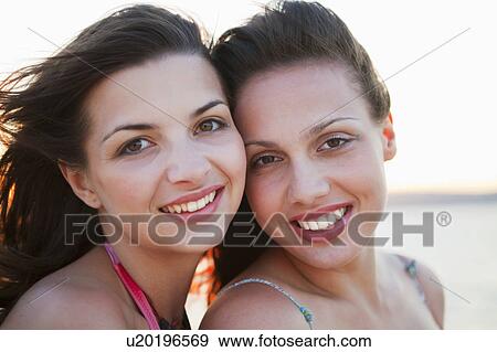 Stock Photo - Women at the beach. Fotosearch
