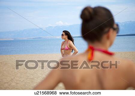 Stock Photo - Women at the beach. Fotosearch