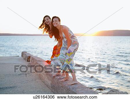Women at the beach View Large Photo Image Stock Photograph - Women at the beach. Fotosearch