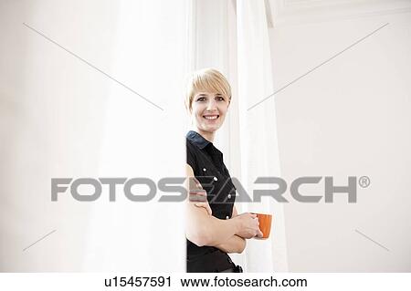 Women enjoying a cup of coffee View Large Photo Image Stock Image - Women enjoying a cup of coffee. Fotosearch