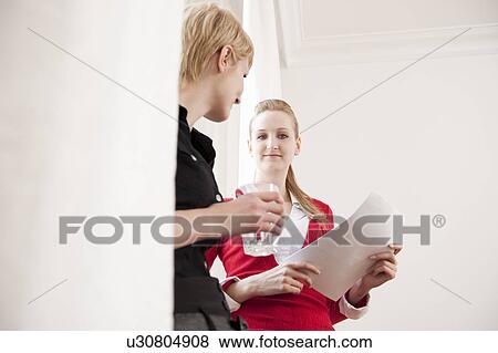 Stock Photo - Women having informal business meeting. Fotosearch