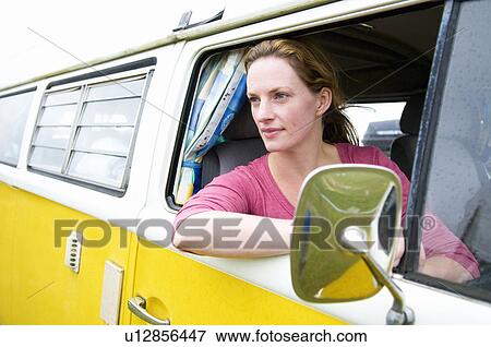 Women looks out of camper van View Large Photo Image Stock Photo - Women looks out of camper van. Fotosearch