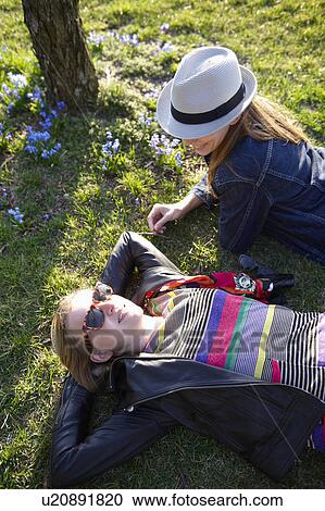 Stock Image - Women taking a break in a park. Fotosearch