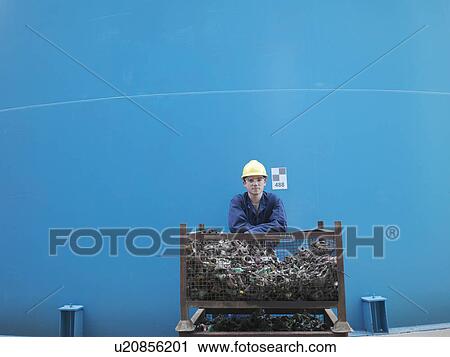 Stock Image - Worker in coal fired power station. Fotosearch