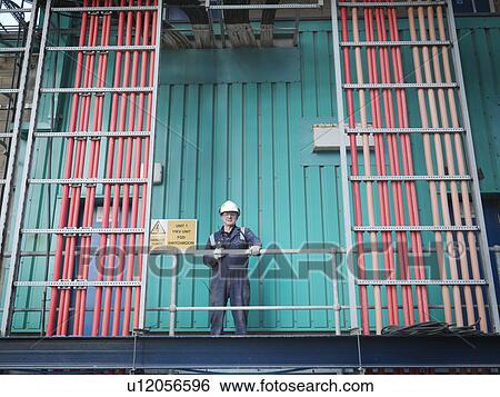 Worker in coal fired power station View Large Photo Image Stock Photograph - Worker in coal fired power station. Fotosearch