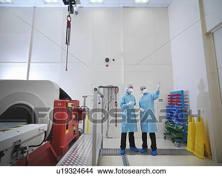 Picture - Worker in satellite testing station. Fotosearch