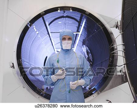 Worker with satellite testing chamber View Large Photo Image Stock Image - Worker with satellite testing chamber. Fotosearch