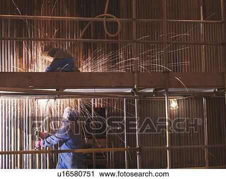 Workers cutting in power station View Large Photo Image Stock Image - Workers cutting in power station. Fotosearch