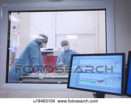 Picture - Workers in clean room. Fotosearch
