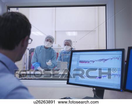 Workers in clean room View Large Photo Image Stock Image - Workers in clean room. Fotosearch