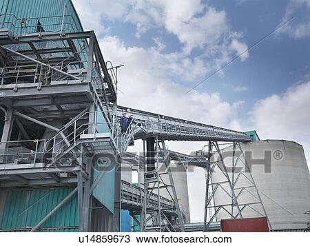 Stock Image - Workers in coal fired power station. Fotosearch