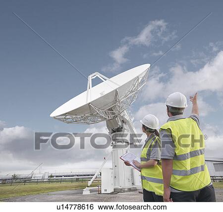 Workers with satellite dish View Large Photo Image Stock Photograph - Workers with satellite dish. Fotosearch