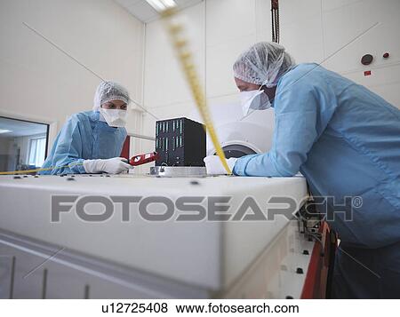 Workers with vibration testing table View Large Photo Image Stock Photo - Workers with vibration testing table. Fotosearch