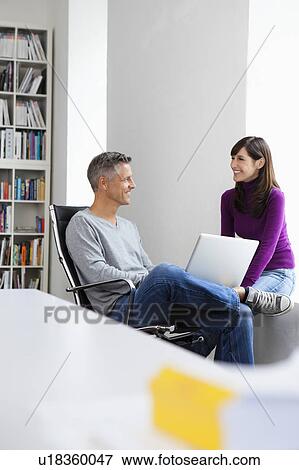 Workmates chatting View Large Photo Image Stock Photo - Workmates chatting. Fotosearch