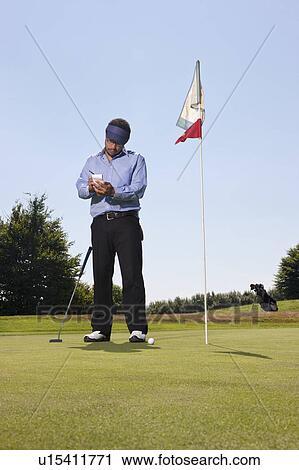 Writing down the score on a golf course View Large Photo Image Stock Image - Writing down the score on a golf course. Fotosearch