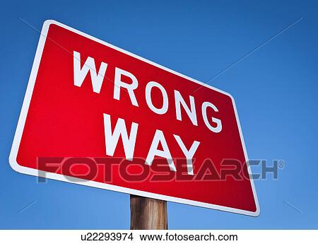 Wrong way sign against blue sky View Large Photo Image Picture - Wrong way sign against blue sky. Fotosearch