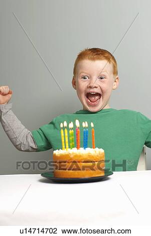 Young boy excited with birthday cake View Large Photo Image Stock Image - Young boy excited with birthday cake. Fotosearch