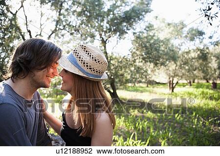 Young couple going for a kiss View Large Photo Image Stock Image - Young couple going for a kiss. Fotosearch