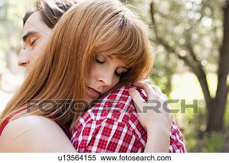 Stock Photography - Young couple hugging close up. Fotosearch