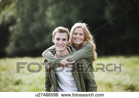 Young couple in nature View Large Photo Image Stock Photo - Young couple in nature. Fotosearch