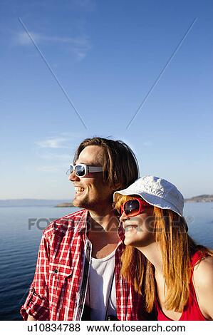 Young couple looking to sea View Large Photo Image Stock Photo - Young couple looking to sea. Fotosearch