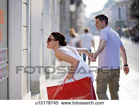 Stock Photography - Young couple shopping. Fotosearch