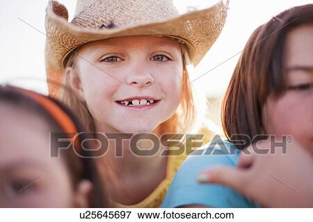 Stock Photo - Young girl in hat smiling. Fotosearch